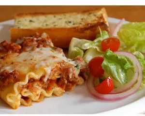 Picture of dish Butter Chicken Lasagna & Garlic Bread at Chickasta Vancouver